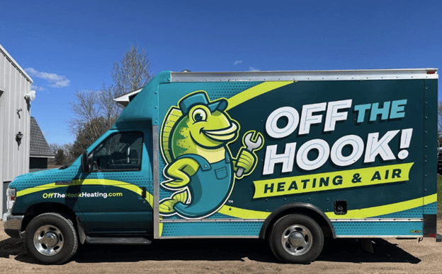 Off The Hook Heating & Air staff after donating winter coats to CAER in Zimmerman